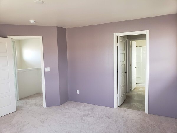Bedroom with light purple walls
