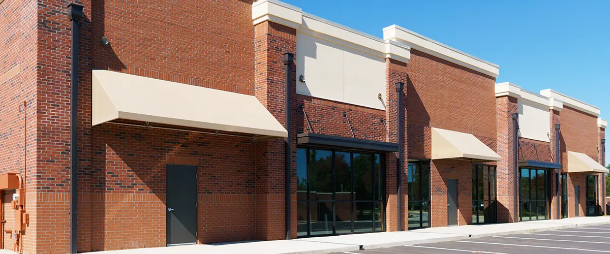 Transparent finish on a large brick commercial building