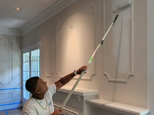 Process of painting a white wall
